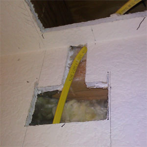 Run wire through wall to ceiling